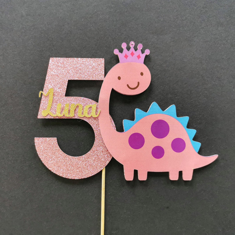 Pink dinosaur cake topper